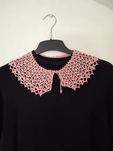 A delicate pink lace collar.