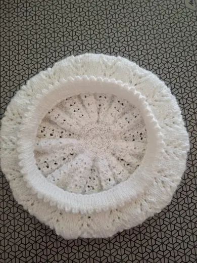 The beret is white.