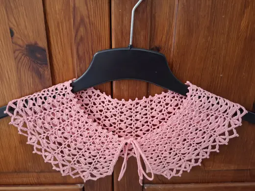 A delicate pink lace collar.